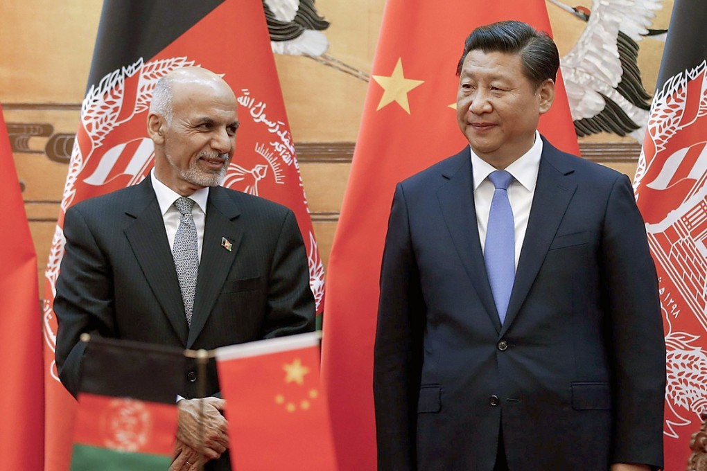 Afghan leader Ashraf Ghani and President Xi Jinping attend a signing ceremony at the Great Hall of the People in Beijing. Photo: Reuters