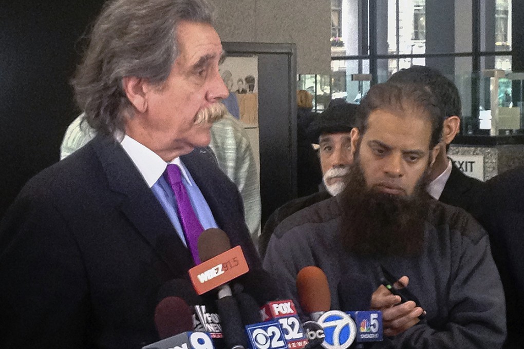 Thomas Durkin (left), defence attorney for Mohammed Hamzah Khan, speaks with reporters after a detention hearing in Chicago. Photo: AP