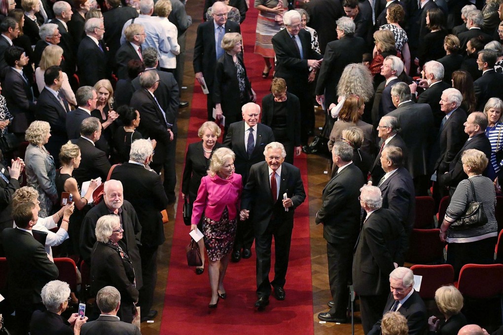 Former prime ministers Bob Hawke (front right) and John Howard (behind him) at the memorial service. Photo: Reuters