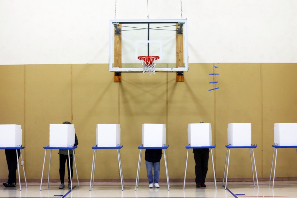 Voters cast their ballots in Albany, in the state of New York, where Governor Andrew Cuomo is bidding for a second term against Republican Rob Astorino. Photo: The Washington Post