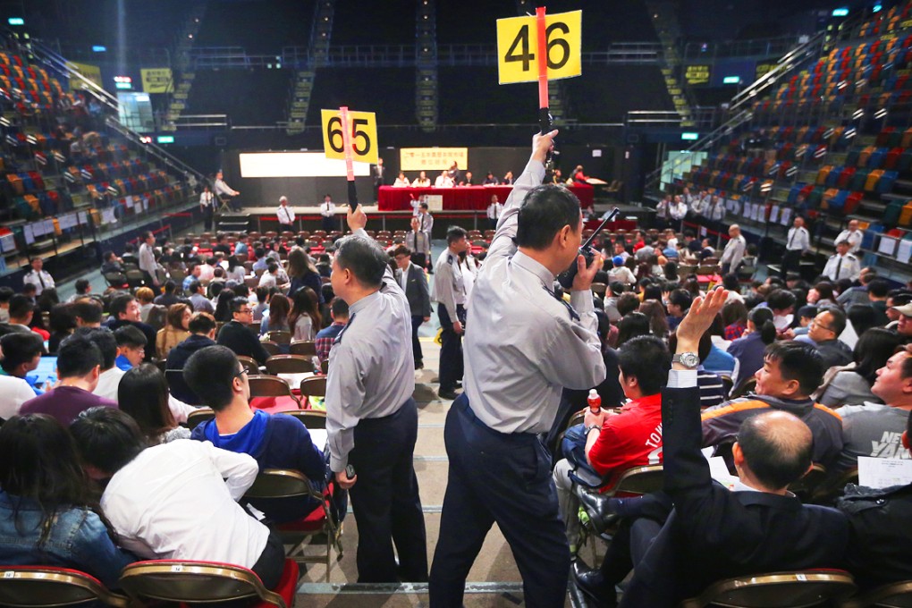 Businesses and democracy advocates alike bid for themed and dry-goods stalls at Queen Elizabeth Stadium in Wan Chai. Photo: Sam Tsang