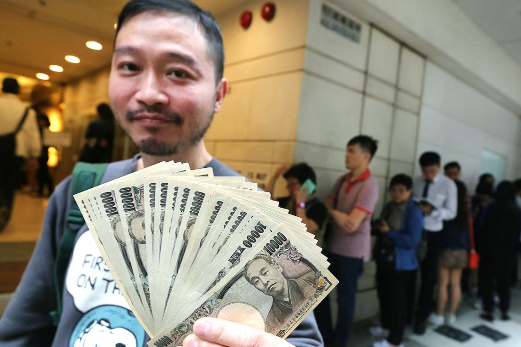 Barry Chan is happy with the rate he got at the Berlin Company Exchange in Central. Photo: Felix Wong