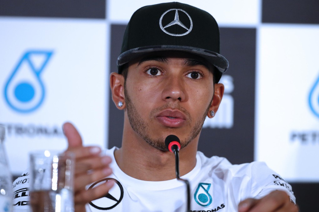 Lewis Hamilton says he will keep his head down and just keep chipping away in the race for the F1 championship. Photos: AP