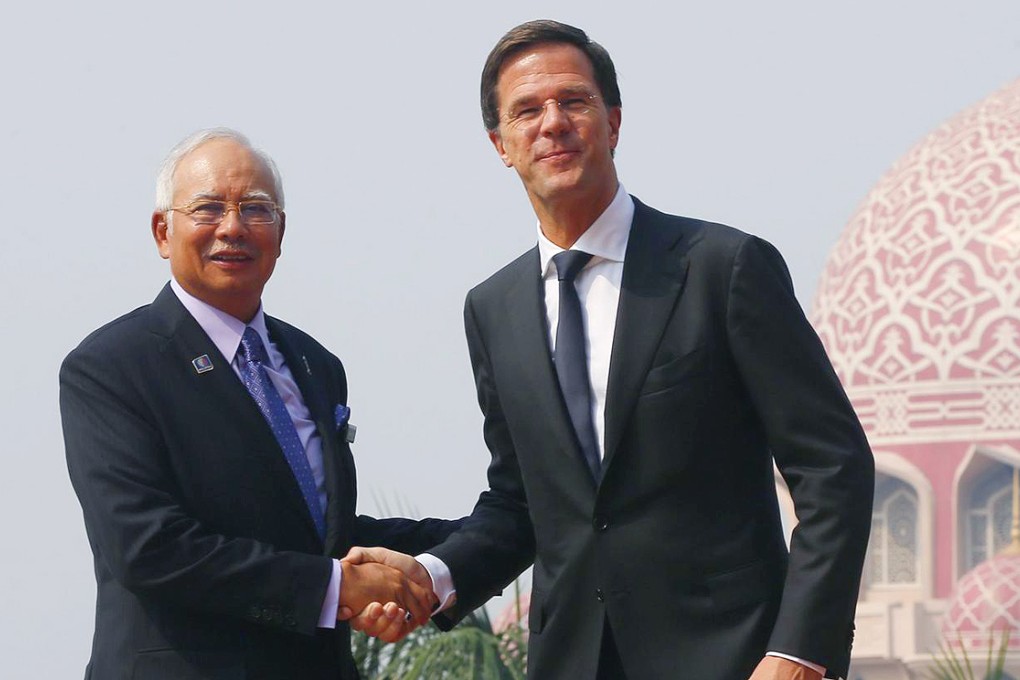 Malaysian Prime Minister Najib Razak welcomes Dutch counterpart Mark Rutte in Putrajaya yesterday. Photo: EPA