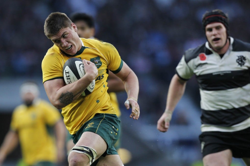 Sean McMahon heads for the try line to score for Australia against the Barbarians. Photo: AFP