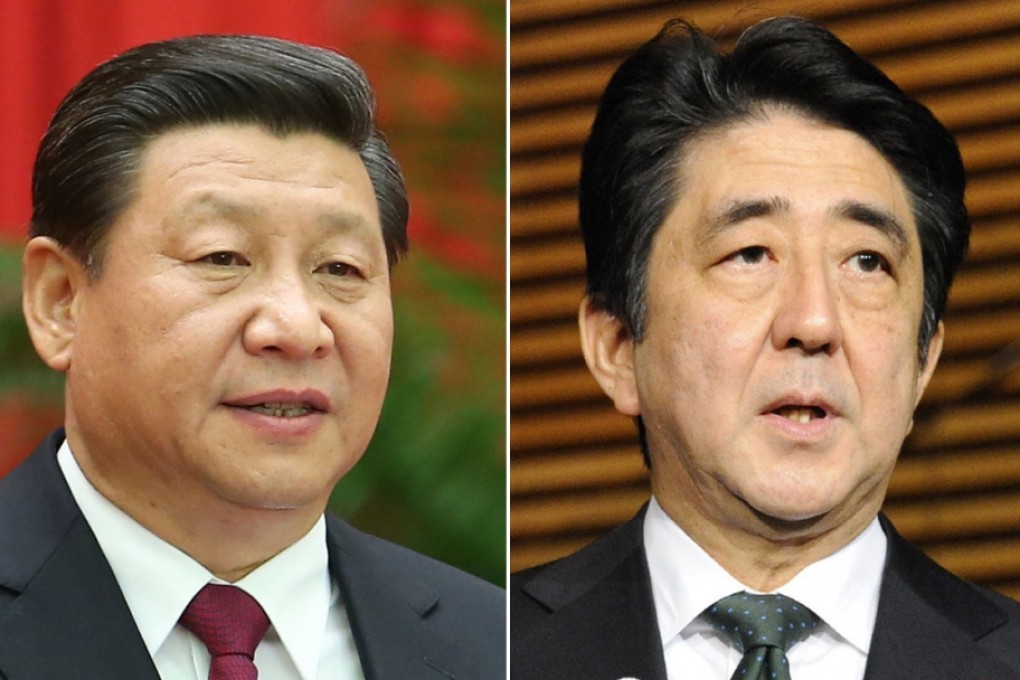Chinese President Xi Jinping (left) and Japan counterpart Shinzo Abe.
