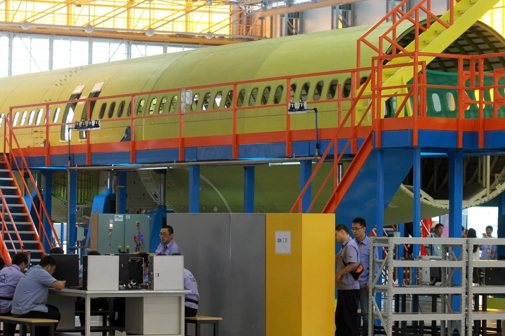 The C919 currently under development by Comac is a narrow-body version. The firm is now seeking suppliers to develop a widebody passenger plane. Photo: Xinhua