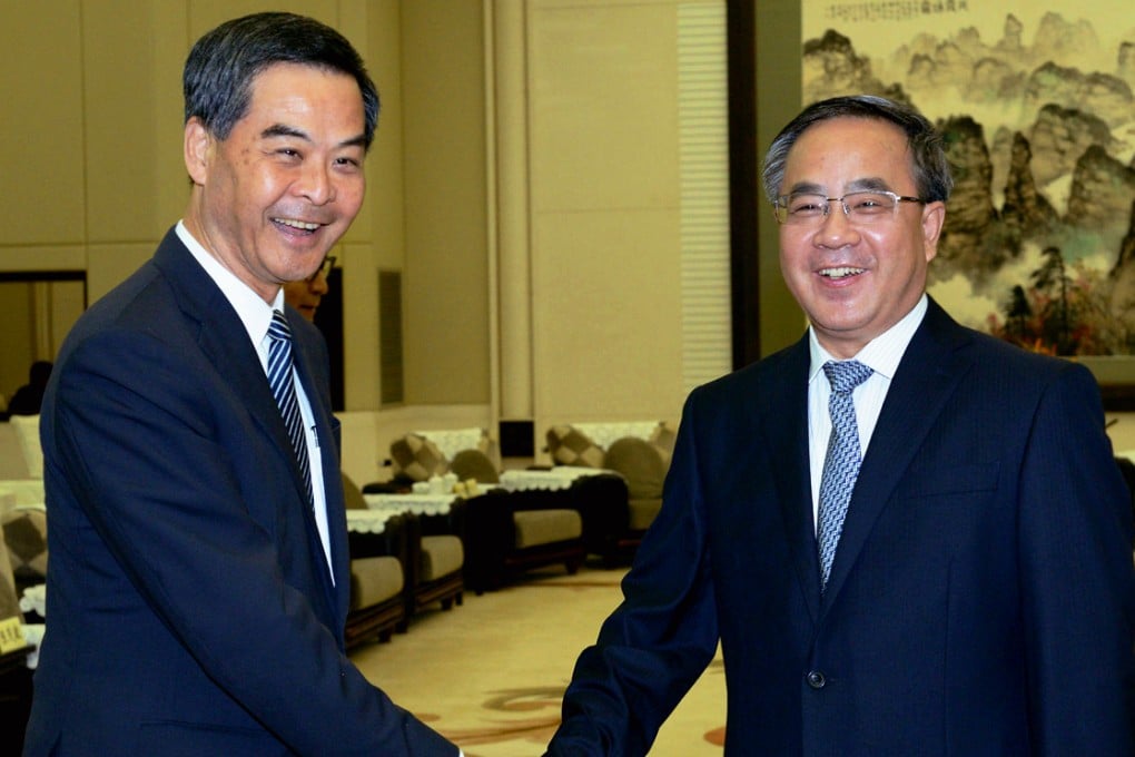 Leung with Guangdong Party chief Hu Chunhua. Photo: SCMP