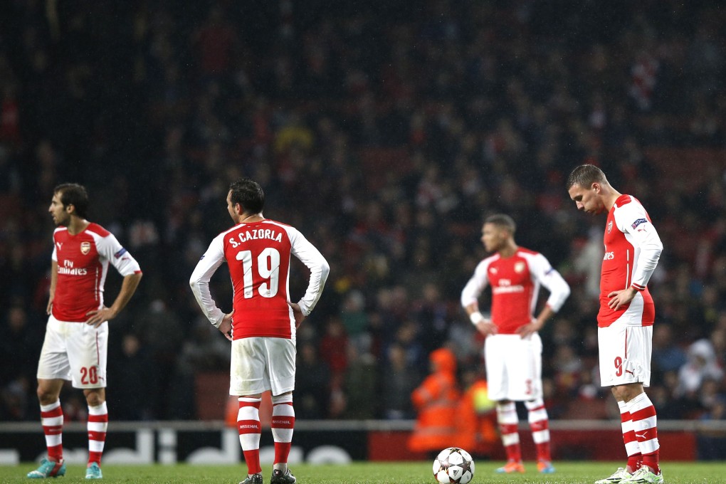 Arsenal fans fell silent after the Gunners were held to a 3-3 draw by Anderlecht in the Champions League. Photos: AFP