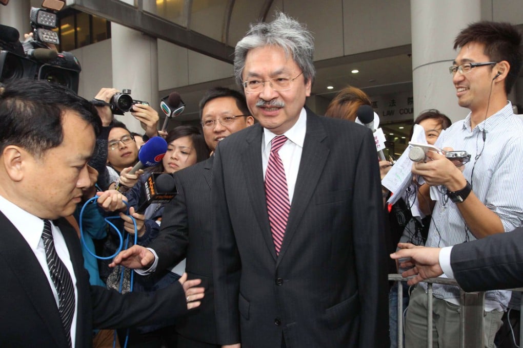 John Tsang greets the media outside Eastern Court on Friday morning. Photo: Edward Wong