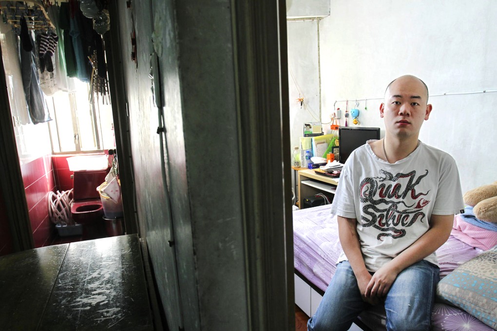 Wong Yik-mo is one of many residents whose income is too high to qualify for subsidised housing, but too low to afford renting in the open market. He lives with his parents. Photo: May Tse