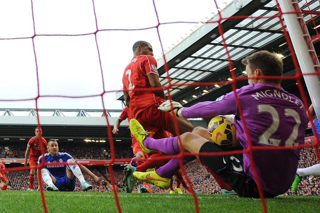 Liverpool goalkeeper Simon Mignolet concedes Chelsea's equaliser from a Gary Cahill strike. Chelsea won 2-1 at Anfield. Photos: EPA, Reuters