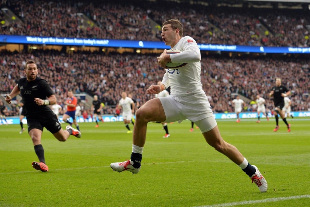 England winger Jonny May runs in the opening try in their one-off match against New Zealand’s All Blacks at Twickenham. Photos: AFP