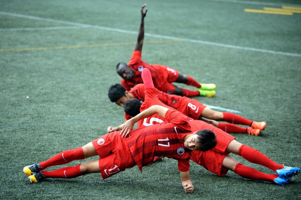 Hong Kong team members Lee Hong-lim (front), Andy Naegelein (5), Xu Deshuai (8), Wisdom Agbo (back) at training yesterday. Photo: Xinhua