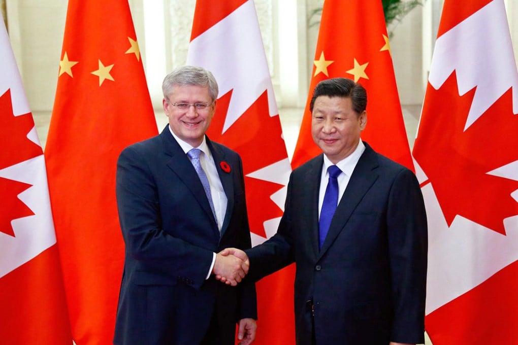 President Xi Jinping (right) held talks with Canadian Prime Minister Stephen Harper yesterday.