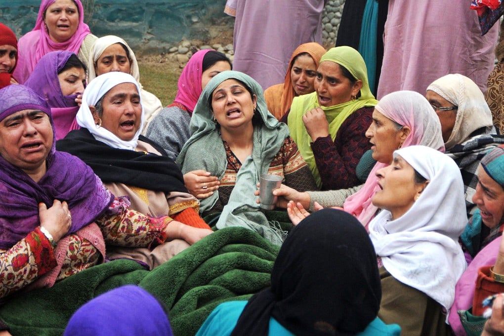 Kashmiri women mourn during the funeral of the two civilians shot dead by soldiers. Photo: AFP