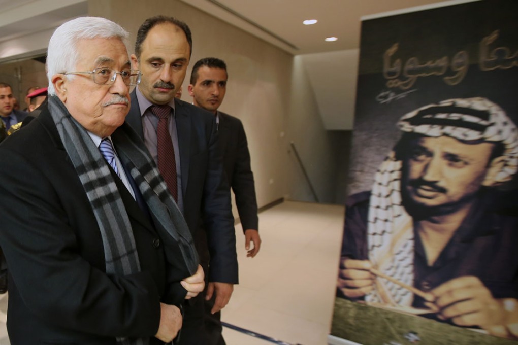 Palestinian President Mahmoud Abbas (left) arrives for the opening of a museum for late Palestinian leader Yasser Arafat in the West Bank city of Ramallah. Photo: AP