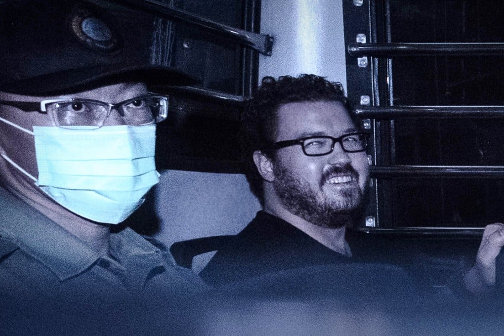 British banker Rurik Jutting smiles as he leaves court yesterday after his double-murder case was adjourned for two weeks. Photo: AFP