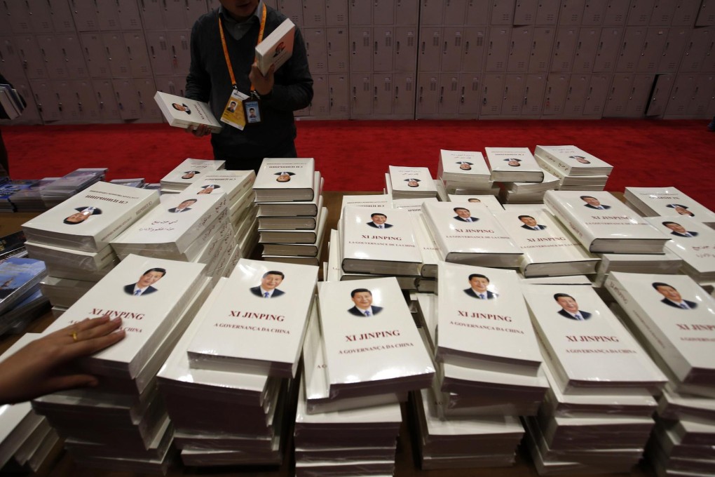 Journalists were keen to get their hands on Xi's book. Photo: Reuters