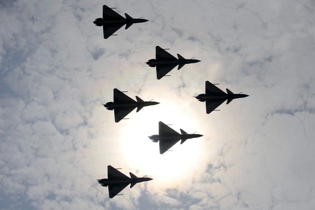 J-10 jet fighters of the PLA Air Force aerobatic team perform at the Zhuhau airshow. Some 700 foreign and domestic exhibitors with 130-plus planes are due to attend the event this week. Photo: Xinhua