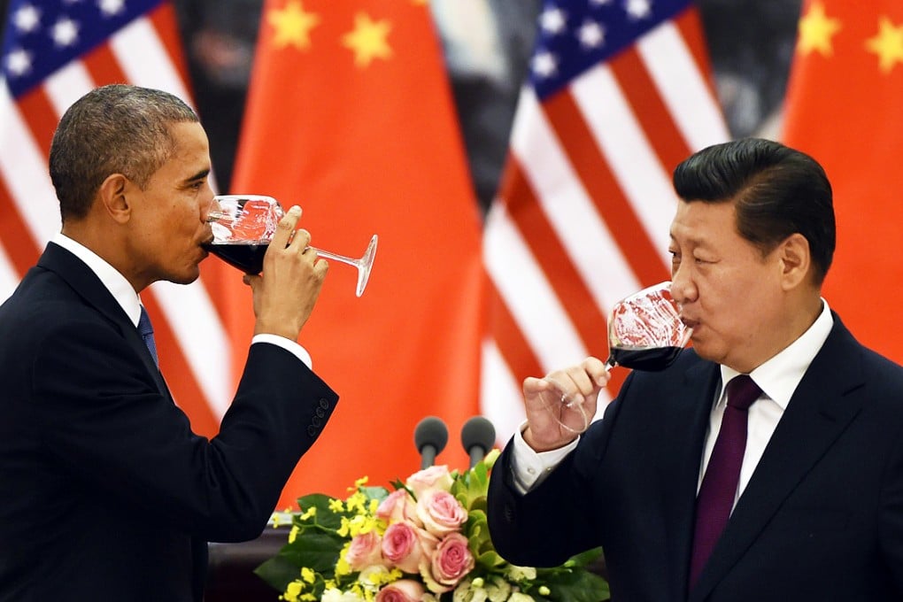 After two days of intense negotiations, Barack Obama and Xi Jinping share a toast at the Great Hall of the People in Beijing. They reached agreement on a host of issues including climate change. Photo: AFP