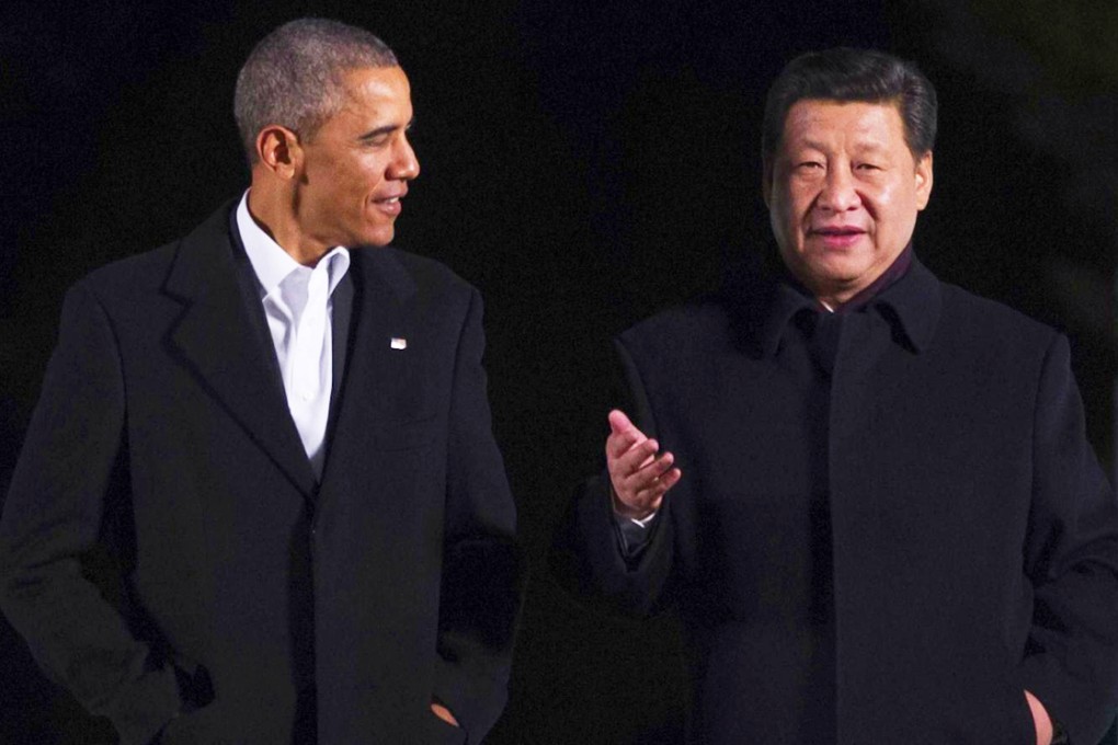 Presidents Barack Obama and Xi Jinping chat informally as they take a stroll at the Zhongnanhai leaders compound in Beijing before enjoying a private dinner. Photo: AFP