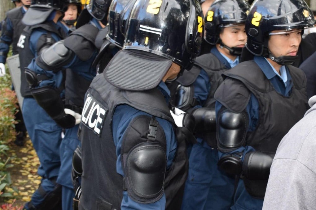 Riot police raid the dormitory at Kyoto University.Photo: AFP