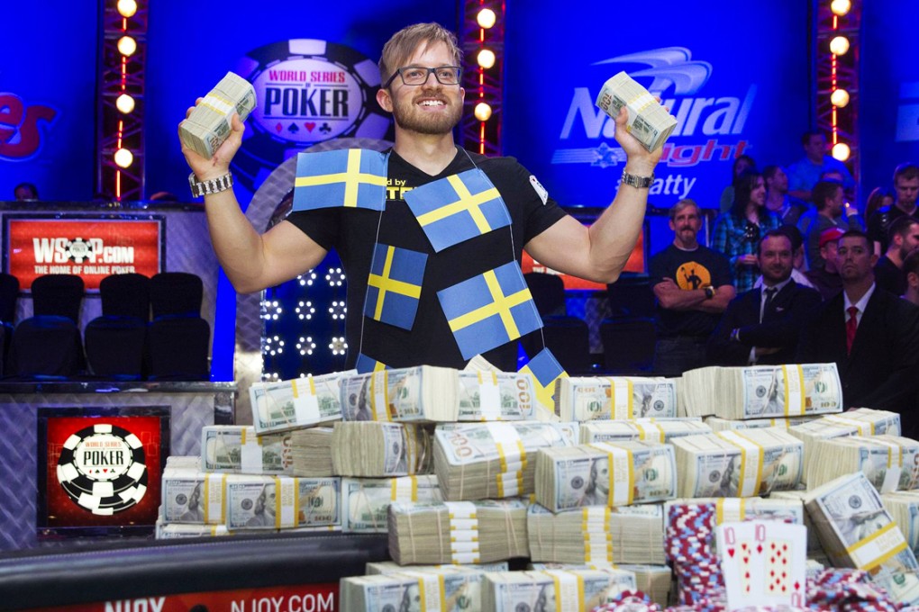 Poker champion Martin Jacobson poses with his cash. Photo: Reuters
