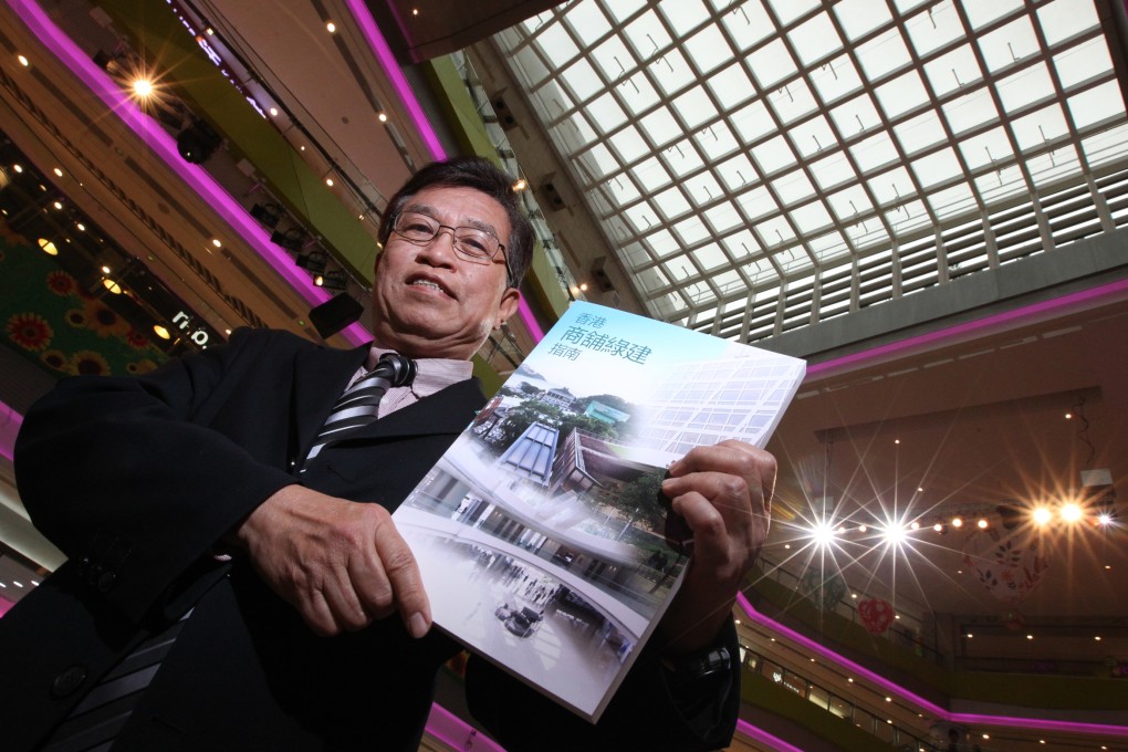 Cheung Hau-wai, vice chairman of the Hong Kong Green Building Council, shows the Hong Kong Green Shop Guide. Photo: Nora Tam