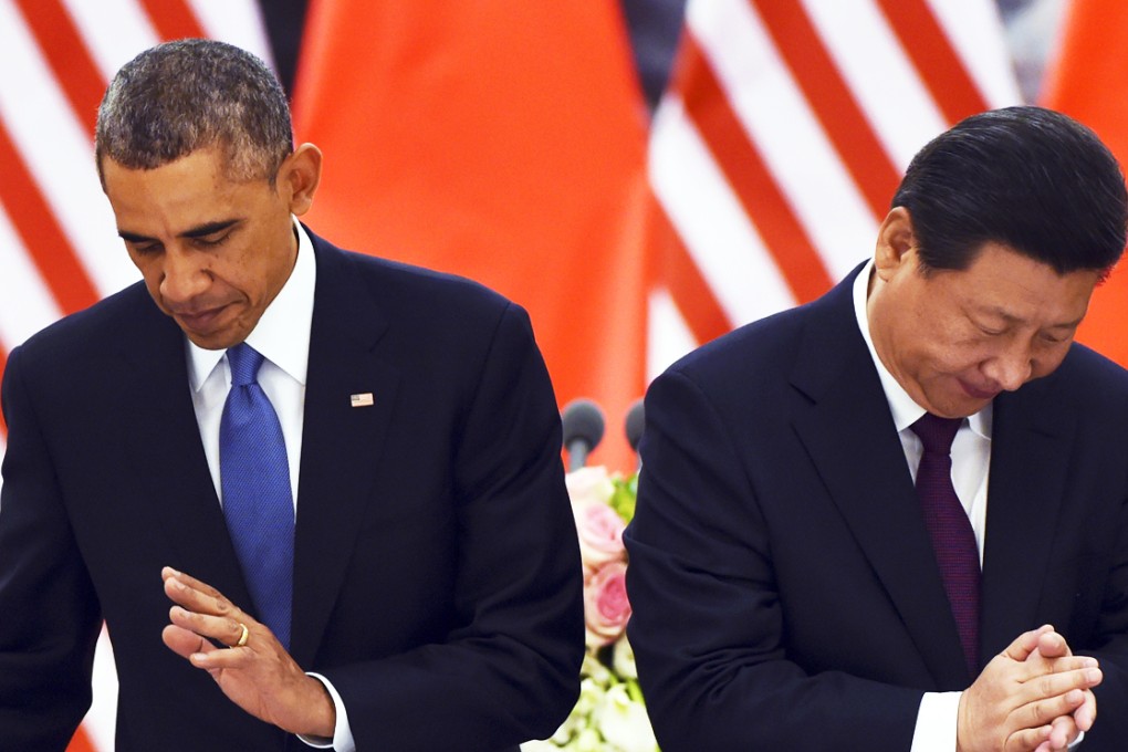 US President Barack Obama listens as Chinese President Xi Jinping speaks at a lunch banquet in the Great Hall of the People in Beijing. Photo: AP