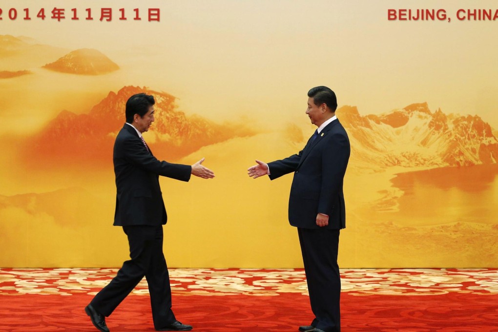 Abe and Xi reach out at Apec