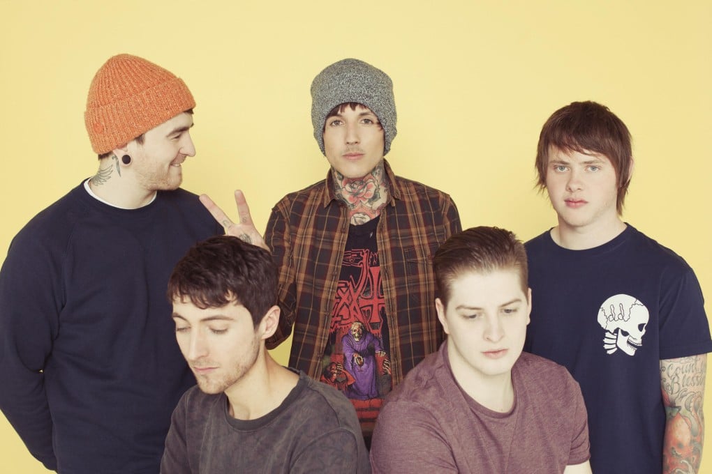 Making peace: Sykes (centre) with bandmates (from left) Matt Nicholls, Jordan Fish, Matt Kean and Lee Malia.