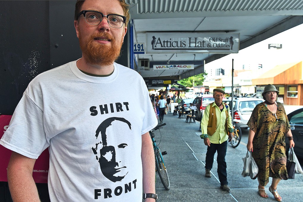 A Brisbane resident wears a t-shirt that features Russia's President Vladimir Putin and a quote from Australia's Prime Minister Tony Abbott threatening to "shirt front" Putin - an Australian sporting term - when the two leaders meet at the G20 Leader's Summit. Photo: AFP