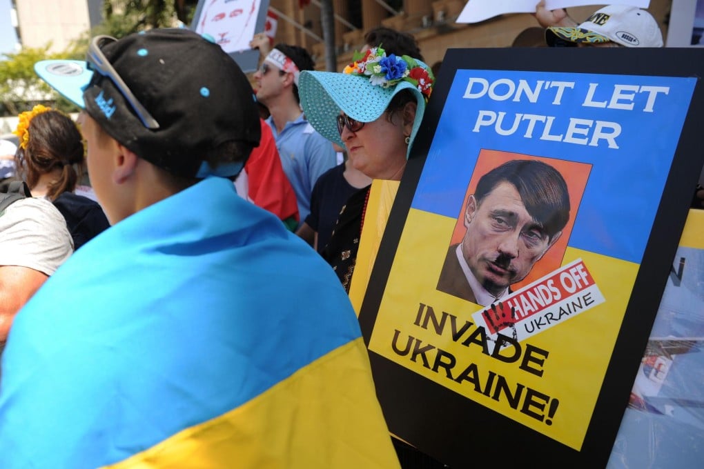 People protest against Vladimir Putin in Brisbane. Photo: AFP