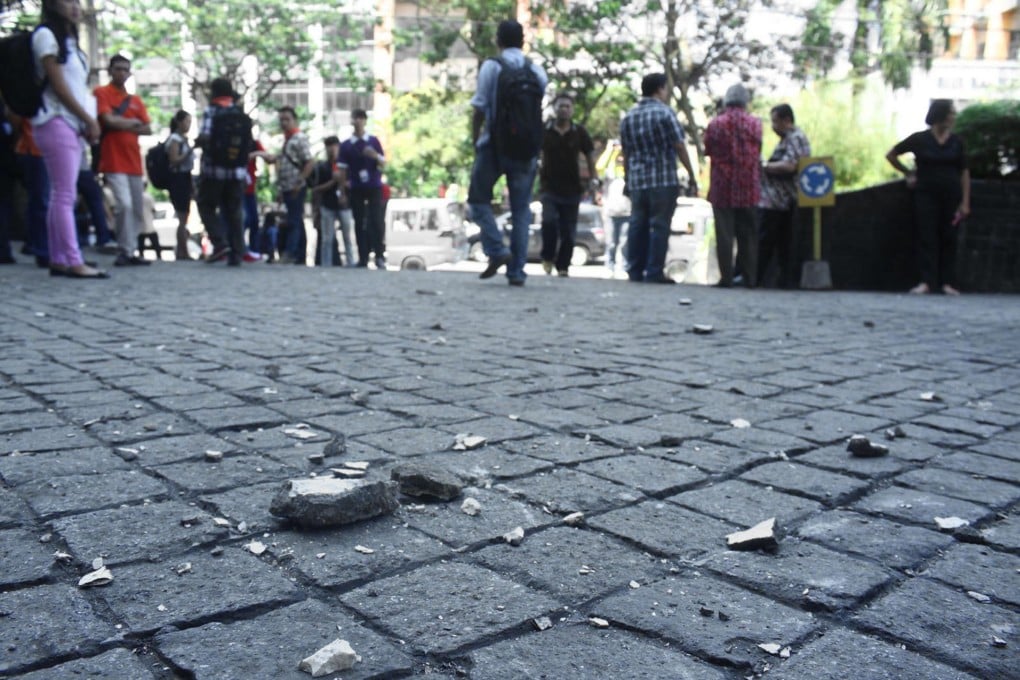 Concrete fragments from a building in Manado city. Photo: AFP