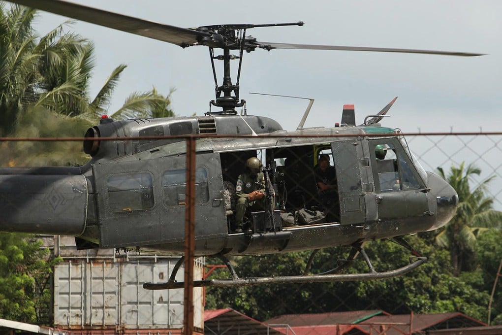 An airforce chopper in Sulu transports the bodies of Filipino soldiers killed in military offensive against al-Qaeda linked insurgents. Photo: EPA