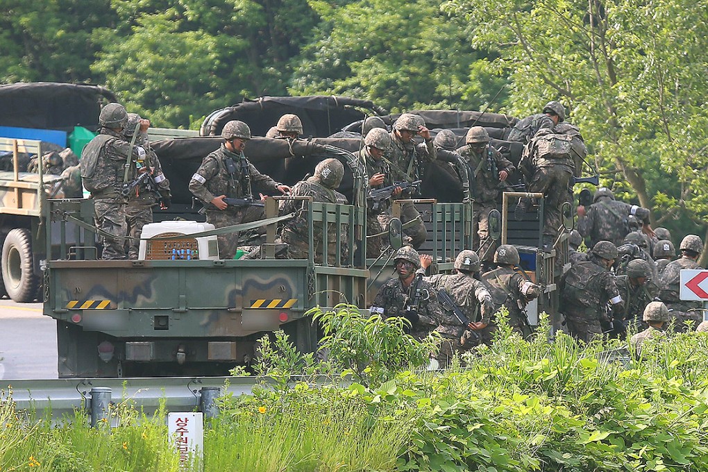 South Korean soldiers disembark from military vehicles near the Demilitarised Zone (DMZ) between the two Koreas. Photo: AFP