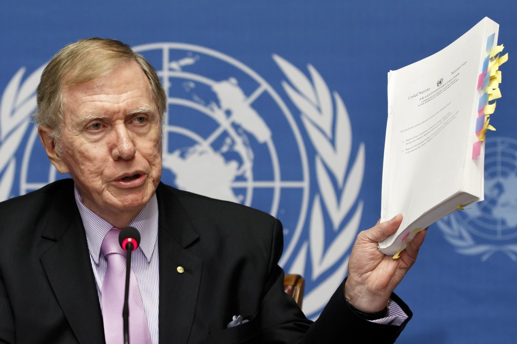 Michael Kirby, Chairman of the Commission of Inquiry on Human Rights in North Korea, shows a report on the human rights violations in North Korea during a press conference. Photo: EPA
