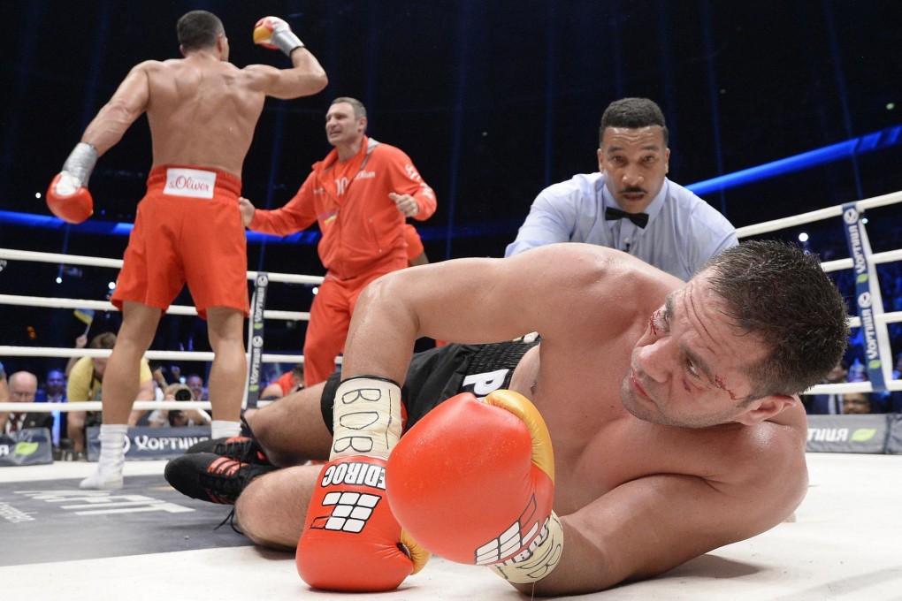 Kubrat Pulev lies dazed after being knocked down by heavyweight champion Wladimir Klitschko in Hamburg. Photo: Reuters