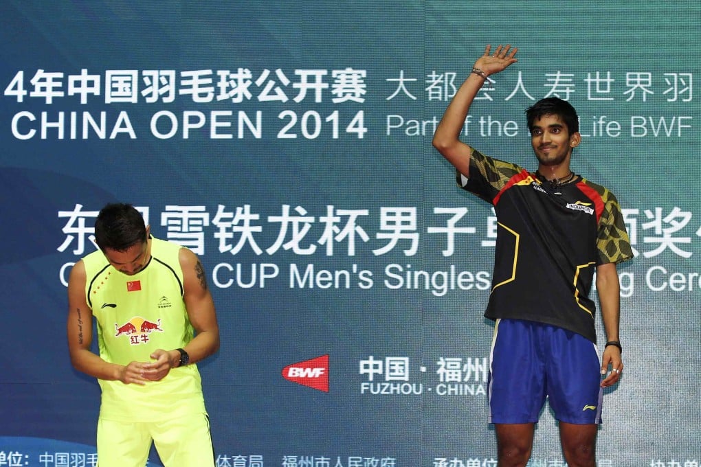 A downcast Lin Dan stands next to India's Kidambi Srikanth who scored an upset win in the final of the China Open in Fuzhou, Fujian province. Photo: Reuters