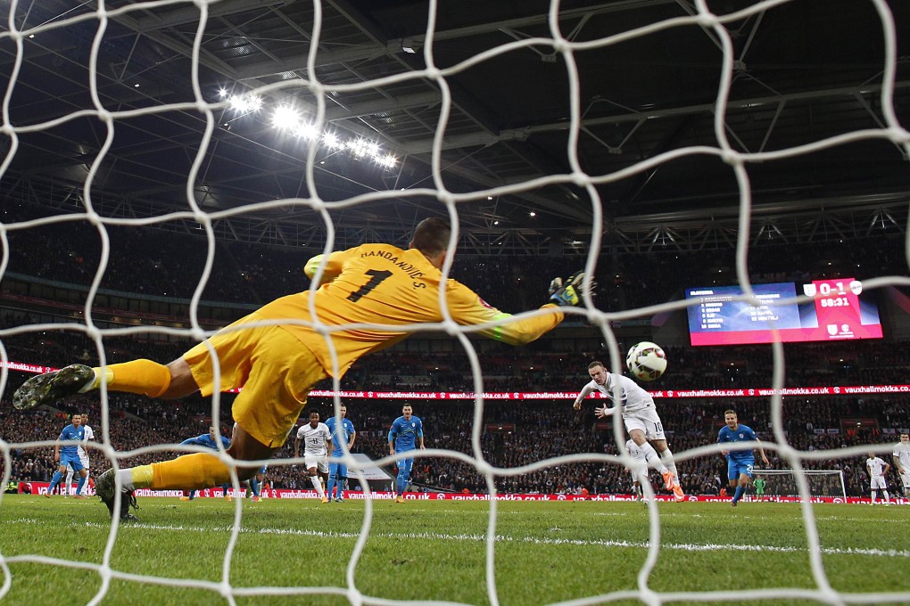 Wayne Rooney scores from the penalty spot during the Euro 2016 qualifier against Slovenia at Wembley. England won 3-1. Photo: AFP