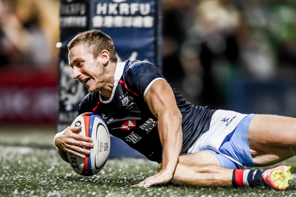 Hong Kong winger Tom McQueen scores the first of two tries against Russia on Saturday. Photos: HKRFU