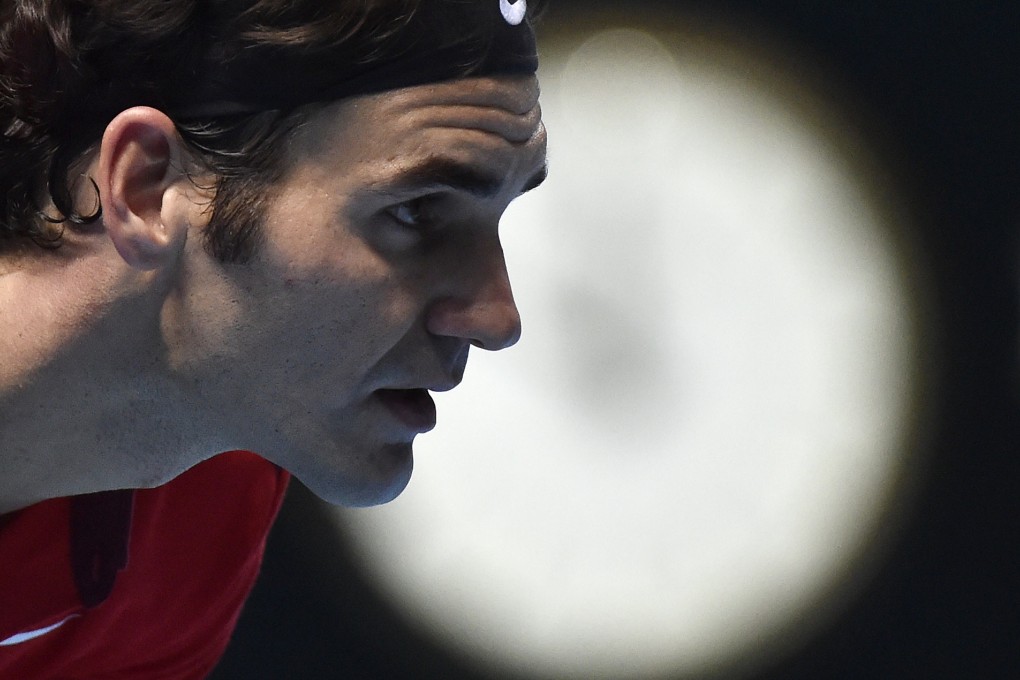 Roger Federer waits for compatriot Stanislas Wawrinka to serve during their epic semi-final at the ATP World Tour Finals. Photo: Reuters