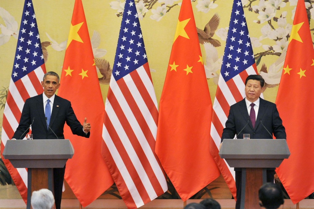US President Barack Obama (left) and Chinese President Xi Jinping at a joint press conference after they agreed to reduce the risk of military conflict and combat climate change in a meeting.