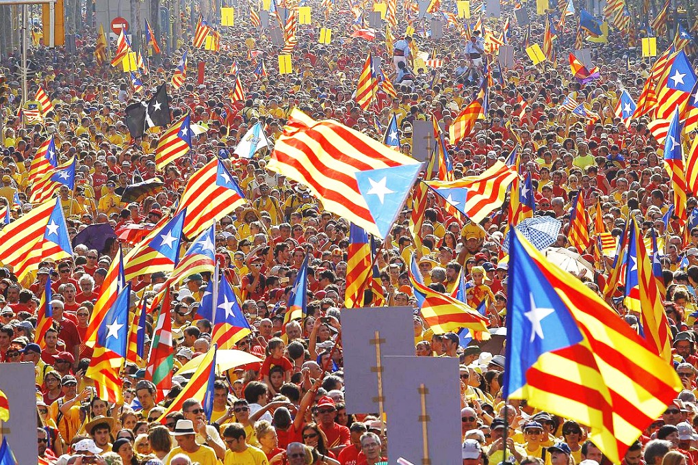 Catalans hold their independence flag. Photo: AFP
