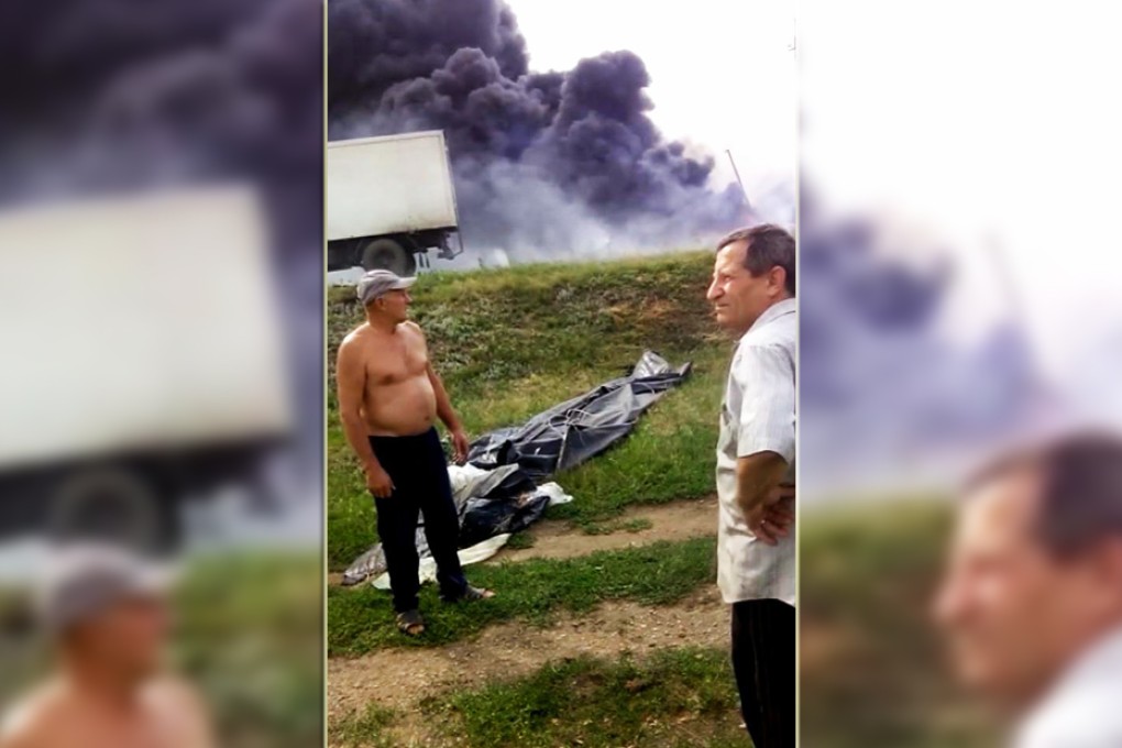 Downed MH17 aircraft nearly hit village in rebel-held eastern