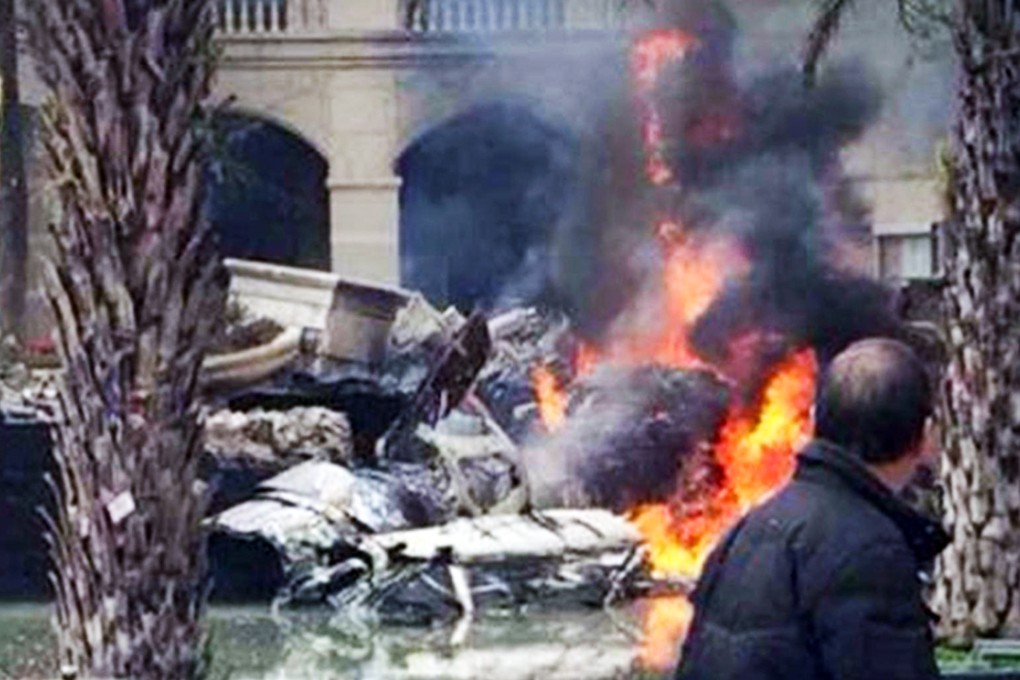 Wreckage from the crashed PLA fighter jet burns at a residential compound in Chengdu yesterday. Photo: SCMP