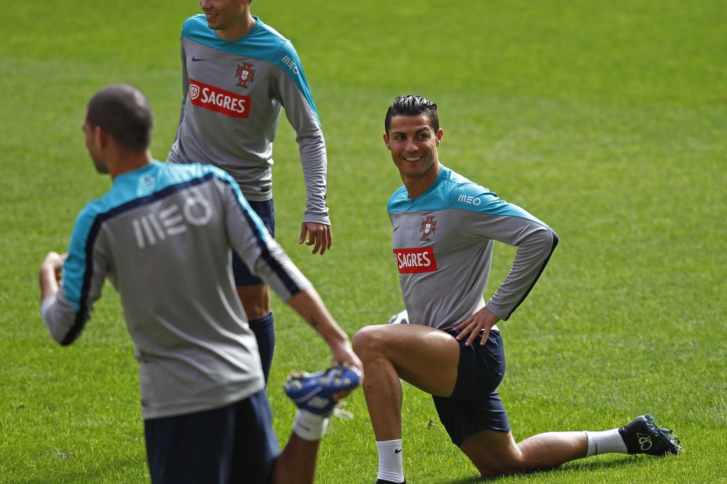 Cristiano Ronaldo (right) trains with his Portugal teammates at the Luz stadium in Lisbon ahead of their international friendly against Argentina at Old Trafford. Photo: Reuters