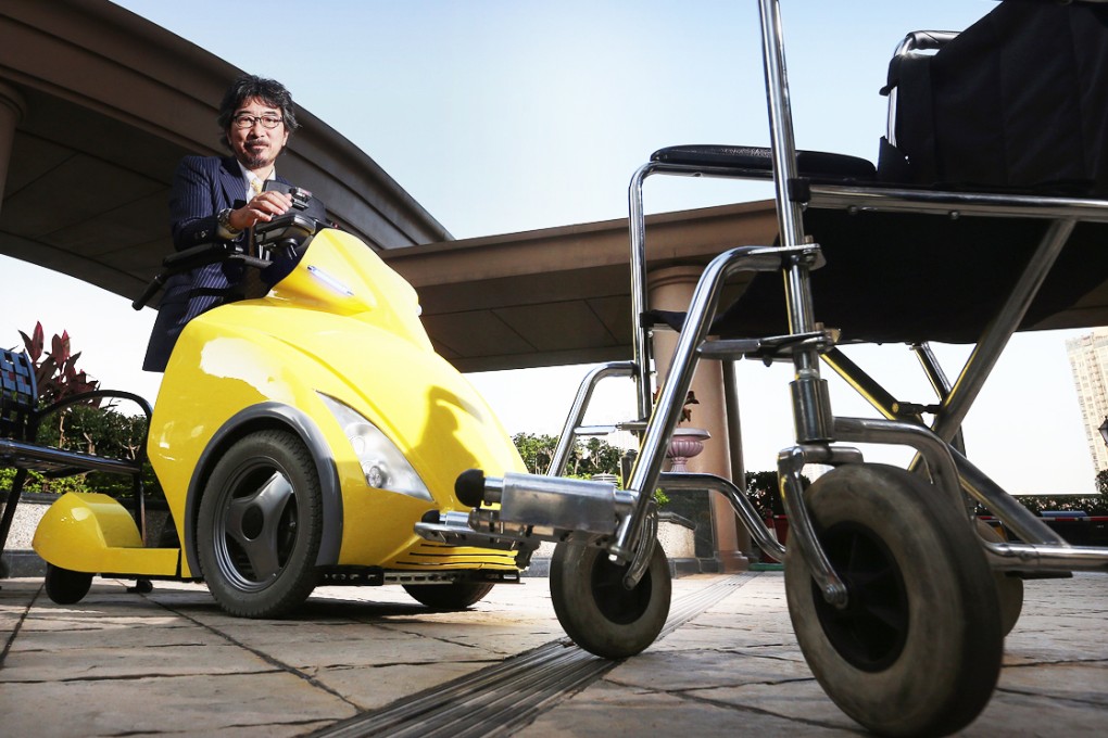 Tmsuk chairman Yoichi Takamoto rides the uniquely designed Rodem robotic wheelchair, which the robotics company plans to launch locally next year. Photo: K. Y. Cheng