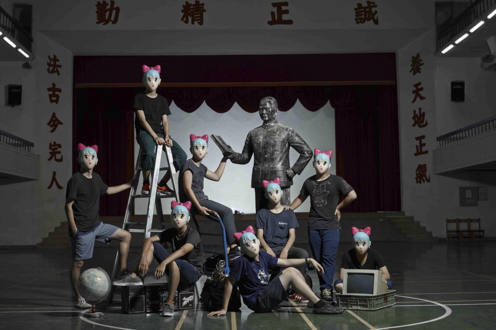 Students don masks in a scene from the film